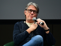 Alain Marschall and Olivier Truchot attend the first book fair in Valence, Drome, on November 2, 2024. (