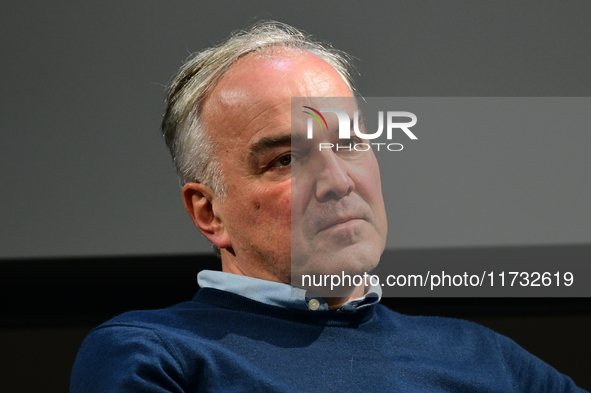 Alain Marschall and Olivier Truchot attend the first book fair in Valence, Drome, on November 2, 2024. 