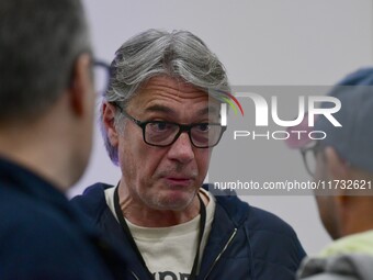 Alain Marschall and Olivier Truchot attend the first book fair in Valence, Drome, on November 2, 2024. (