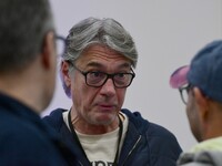 Alain Marschall and Olivier Truchot attend the first book fair in Valence, Drome, on November 2, 2024. (