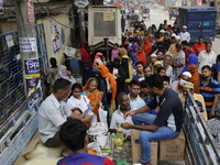 Lower-income people stand in a queue to buy government-subsidized food in Dhaka, Bangladesh, on November 2, 2024. (