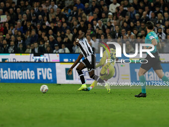 Keinan Davis of Udinese plays against Juan David Cabal of Juventus during the Italian Serie A Enilive soccer championship match between Udin...