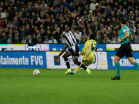 Keinan Davis of Udinese plays against Juan David Cabal of Juventus during the Italian Serie A Enilive soccer championship match between Udin...