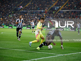 Francisco Conceicao of Juventus plays against Keinan Davis of Udinese during the Italian Serie A Enilive soccer championship match between U...