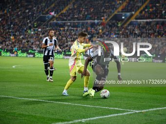 Francisco Conceicao of Juventus plays against Keinan Davis of Udinese during the Italian Serie A Enilive soccer championship match between U...