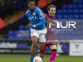 Tayo Adaramola, number 33 of Stockport County F.C., is in action during the FA Cup First Round match between Stockport County and Forest Gre...