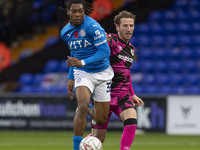 Tayo Adaramola, number 33 of Stockport County F.C., is in action during the FA Cup First Round match between Stockport County and Forest Gre...