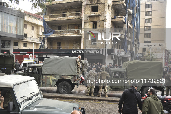 Lebanese security forces take measures in the area after the Israeli attack on an apartment building located at the intersection on the ''Se...