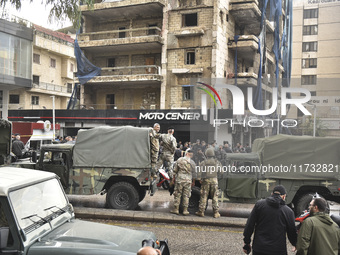 Lebanese security forces take measures in the area after the Israeli attack on an apartment building located at the intersection on the ''Se...