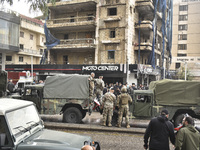 Lebanese security forces take measures in the area after the Israeli attack on an apartment building located at the intersection on the ''Se...