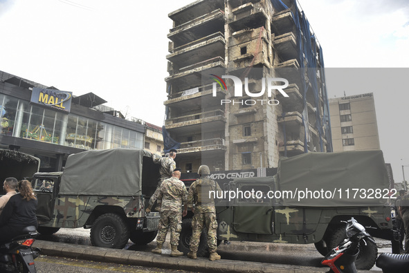 Lebanese security forces take measures in the area after the Israeli attack on an apartment building located at the intersection on the ''Se...