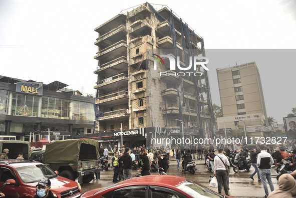 Lebanese security forces take measures in the area after the Israeli attack on an apartment building located at the intersection on the ''Se...