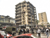 Lebanese security forces take measures in the area after the Israeli attack on an apartment building located at the intersection on the ''Se...