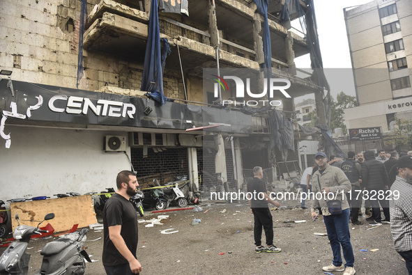 Lebanese security forces take measures in the area after the Israeli attack on an apartment building located at the intersection on the ''Se...