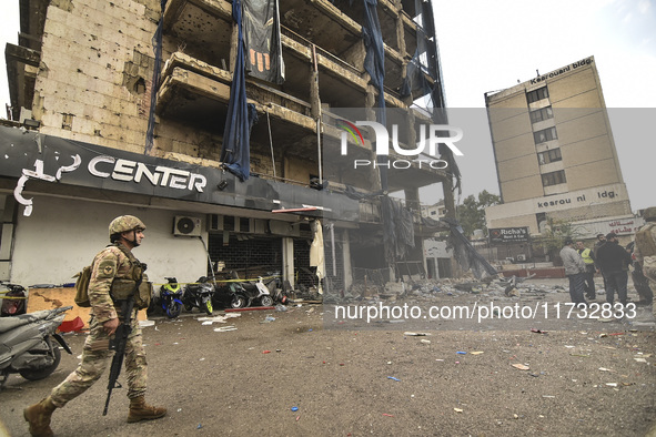 Lebanese security forces take measures in the area after the Israeli attack on an apartment building located at the intersection on the ''Se...