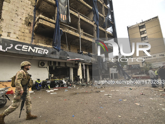 Lebanese security forces take measures in the area after the Israeli attack on an apartment building located at the intersection on the ''Se...