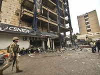 Lebanese security forces take measures in the area after the Israeli attack on an apartment building located at the intersection on the ''Se...