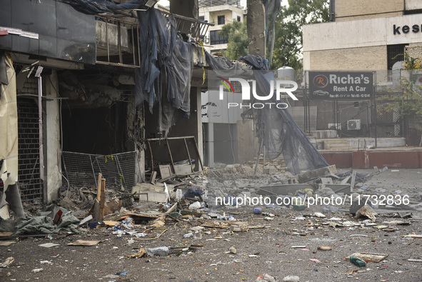 Lebanese security forces take measures in the area after the Israeli attack on an apartment building located at the intersection on the ''Se...