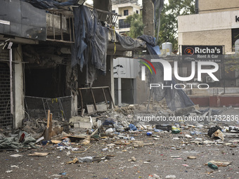 Lebanese security forces take measures in the area after the Israeli attack on an apartment building located at the intersection on the ''Se...