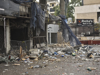 Lebanese security forces take measures in the area after the Israeli attack on an apartment building located at the intersection on the ''Se...