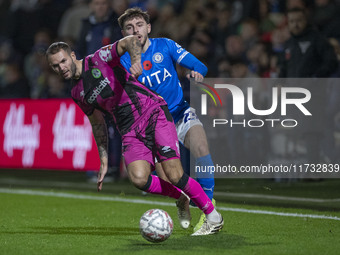 Ryan Rydel #23 of Stockport County F.C. tackles the opponent during the FA Cup First Round match between Stockport County and Forest Green R...