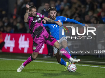 Ryan Rydel #23 of Stockport County F.C. tackles the opponent during the FA Cup First Round match between Stockport County and Forest Green R...