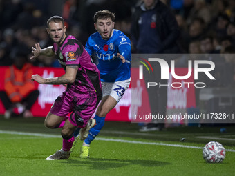 Ryan Rydel #23 of Stockport County F.C. tackles the opponent during the FA Cup First Round match between Stockport County and Forest Green R...