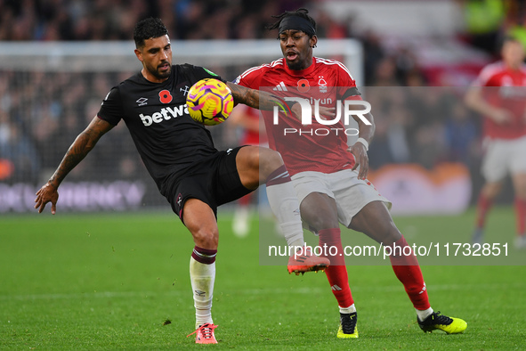 Emerson Palmieri of West Ham United is under pressure from Anthony Elanga of Nottingham Forest during the Premier League match between Notti...