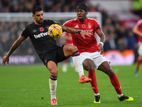 Emerson Palmieri of West Ham United is under pressure from Anthony Elanga of Nottingham Forest during the Premier League match between Notti...