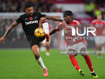 Emerson Palmieri of West Ham United is under pressure from Anthony Elanga of Nottingham Forest during the Premier League match between Notti...