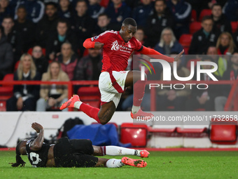 Callum Hudson-Odoi of Nottingham Forest jumps over Aaron Wan-Bissaka of West Ham United during the Premier League match between Nottingham F...