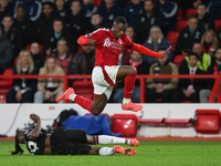 Callum Hudson-Odoi of Nottingham Forest jumps over Aaron Wan-Bissaka of West Ham United during the Premier League match between Nottingham F...