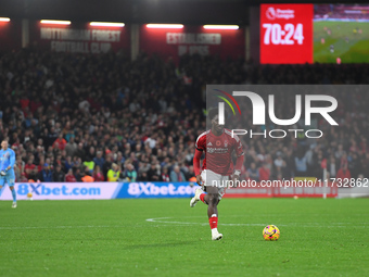 Ola Aina of Nottingham Forest runs with the ball during the Premier League match between Nottingham Forest and West Ham United at the City G...