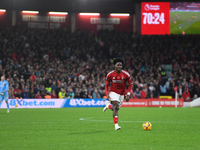 Ola Aina of Nottingham Forest runs with the ball during the Premier League match between Nottingham Forest and West Ham United at the City G...