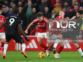 Ryan Yates of Nottingham Forest is under pressure from Michail Antonio of West Ham United during the Premier League match between Nottingham...