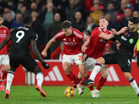 Ryan Yates of Nottingham Forest is under pressure from Michail Antonio of West Ham United during the Premier League match between Nottingham...