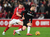 Jarrod Bowen of West Ham United is under pressure from Elliott Anderson of Nottingham Forest during the Premier League match between Notting...