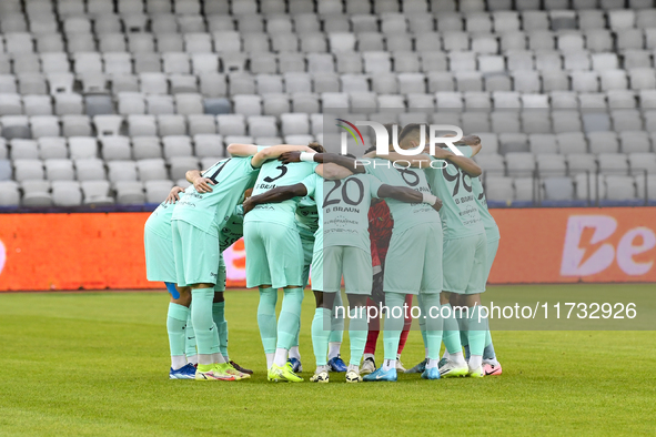 Players of Sanatatea Cluj participate in the Romanian Cup match, Sanatatea Cluj vs. Farul Constanta, in Cluj, Romania, on October 31, 2024,...