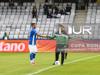 Aurelian Ghisa and Rivaldinho are in action during the Romanian Cup match between Sanatatea Cluj and Farul Constanta at Cluj Arena in Cluj,...