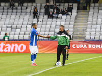 Aurelian Ghisa and Rivaldinho are in action during the Romanian Cup match between Sanatatea Cluj and Farul Constanta at Cluj Arena in Cluj,...