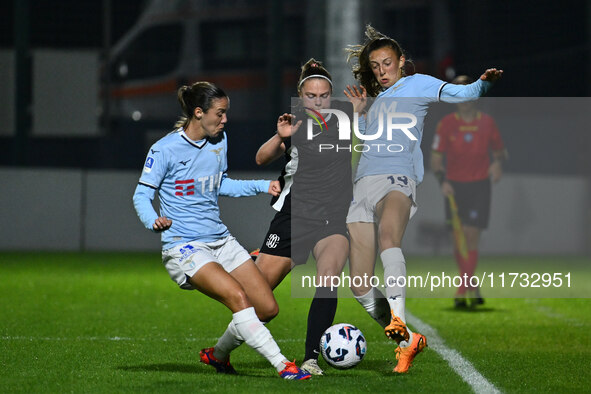 Clarisse Le Bihan of S.S. Lazio, Mina Bergersen of F.C. Como Women, and Martina Zanoli of S.S. Lazio are in action during the 8th day of the...