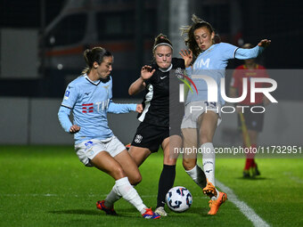 Clarisse Le Bihan of S.S. Lazio, Mina Bergersen of F.C. Como Women, and Martina Zanoli of S.S. Lazio are in action during the 8th day of the...