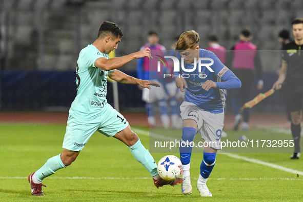 Catalin Cret and Luca Basceanu are in action during the Romanian Cup match between Sanatatea Cluj and Farul Constanta at Cluj Arena in Cluj,...