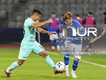 Catalin Cret and Luca Basceanu are in action during the Romanian Cup match between Sanatatea Cluj and Farul Constanta at Cluj Arena in Cluj,...