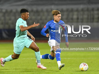 Luca Basceanu and Laley Fofana are in action during the Romanian Cup match between Sanatatea Cluj and Farul Constanta at Cluj Arena in Cluj,...