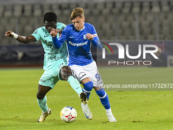 Joseph Aido and Luca Basceanu are in action during the Romanian Cup match between Sanatatea Cluj and Farul Constanta at Cluj Arena in Cluj,...