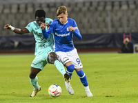 Joseph Aido and Luca Basceanu are in action during the Romanian Cup match between Sanatatea Cluj and Farul Constanta at Cluj Arena in Cluj,...