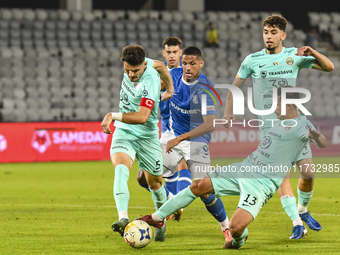 Damian Cimpoiesu, Rivaldinho, and Catalin Cret are in action during the Romanian Cup match between Sanatatea Cluj and Farul Constanta in Clu...