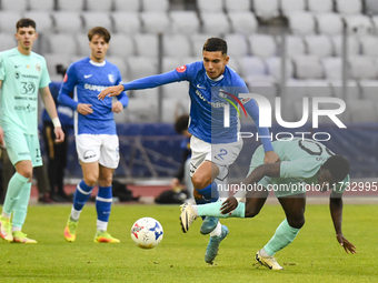 Joseph Aido and Ionut Cercel are in action during the Romanian Cup match between Sanatatea Cluj and Farul Constanta at Cluj Arena in Cluj, R...