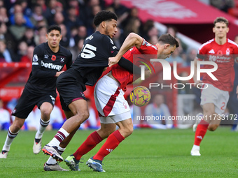 Chris Wood of Nottingham Forest battles with Jean-Clair Todibo of West Ham United during the Premier League match between Nottingham Forest...